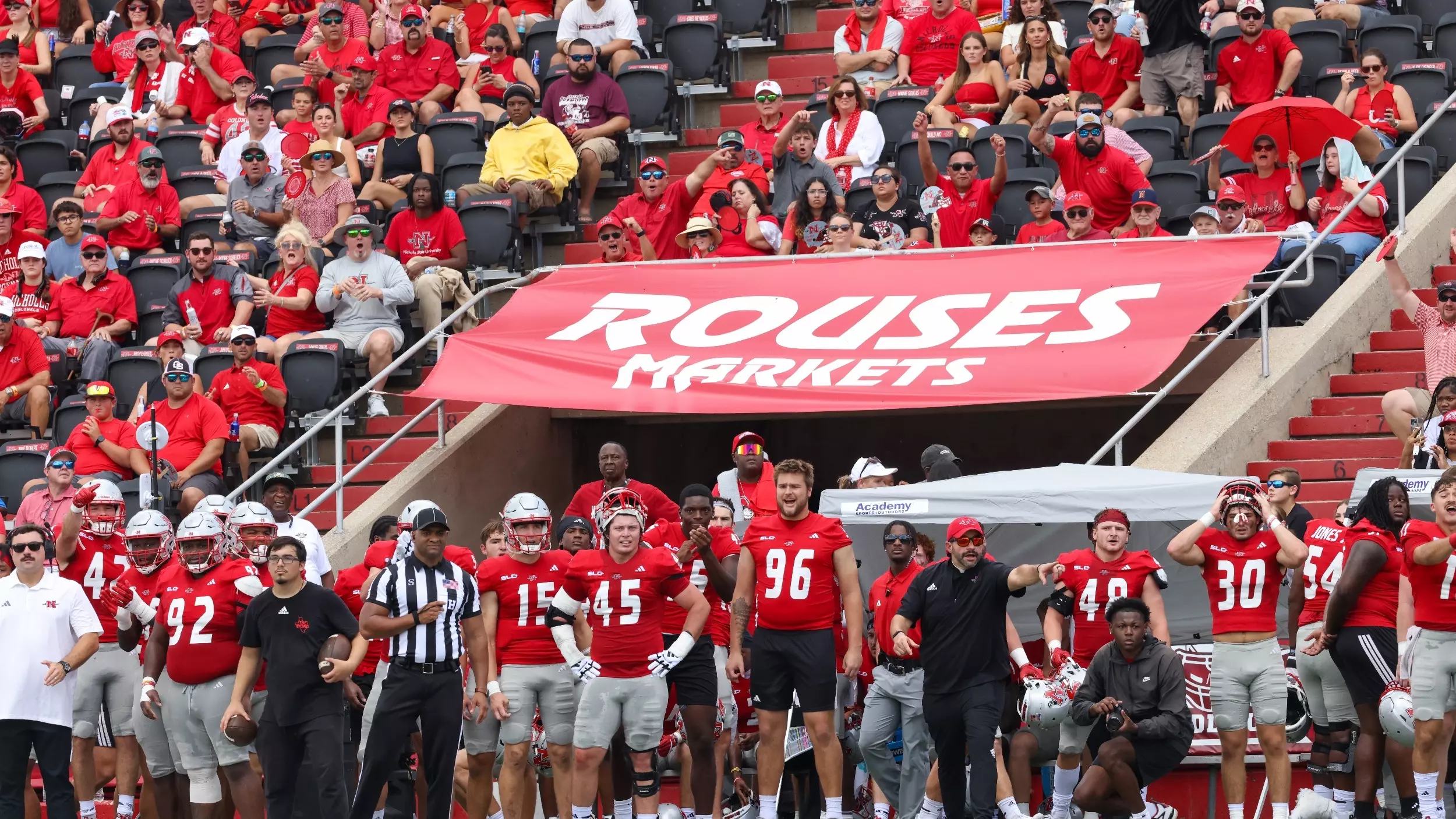 Nicholls State Colonels players and fans in the stands at a home game